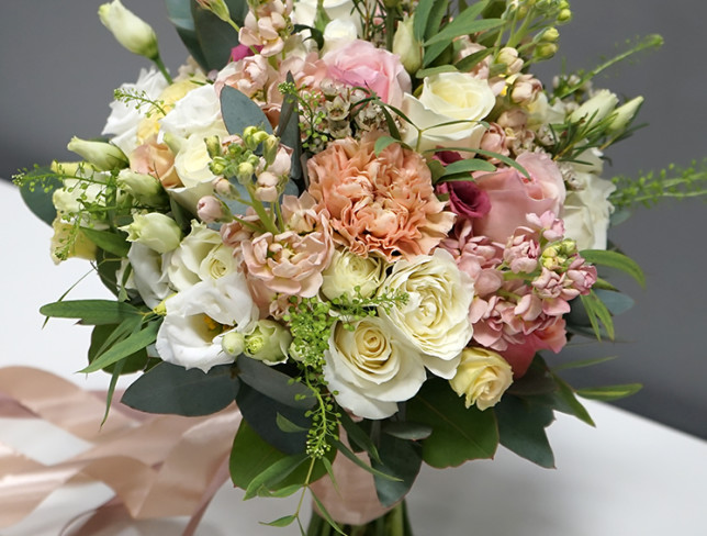 Bride's bouquet in soft pastel colors photo